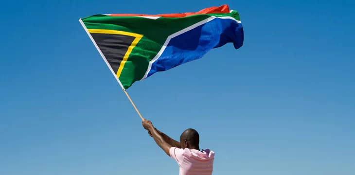 A man waving South Africa flag