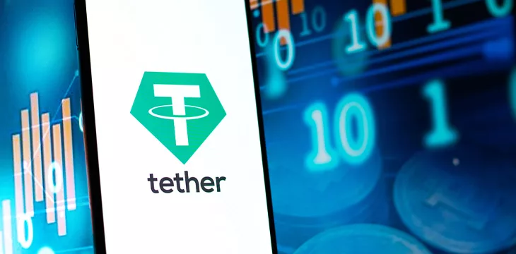 Tether logo on mobile phone