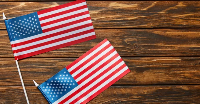 Top view of american flags on wooden surface