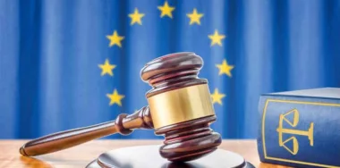 A gavel and a law book with European union symbol as background