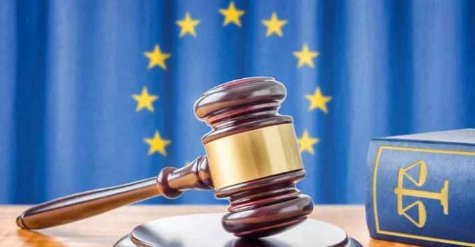 A gavel and a law book with European union symbol as background