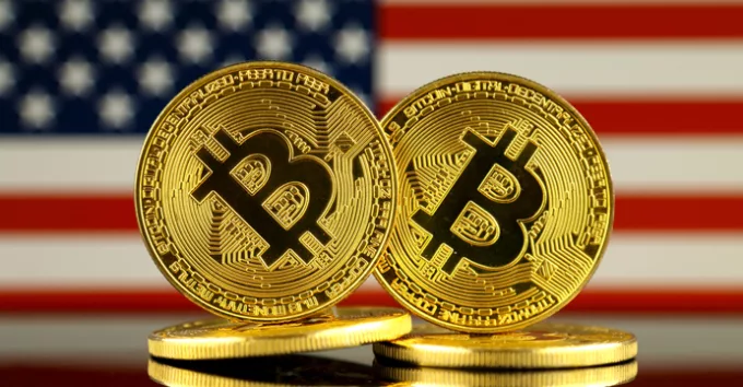 Physical version of Bitcoin and United States Flag