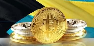 Bitcoin coins on Bahamas Flag