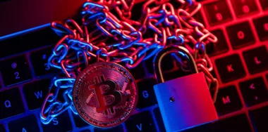 Bitcoin with chain and padlock. Conceptual photography of financial fraud