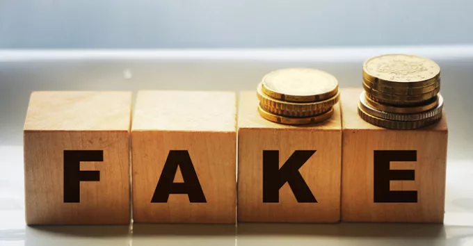 FAKE word written in wooden blocks