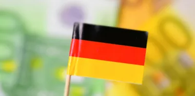Flag of Germany and euro banknotes in the back