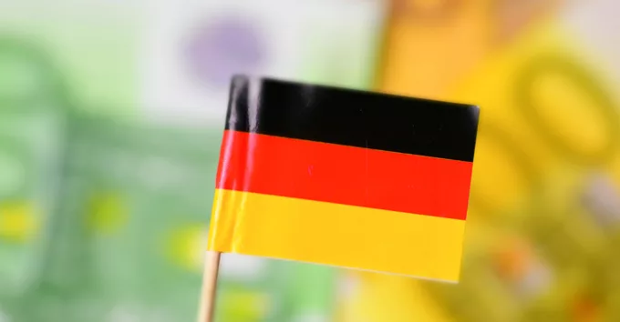 Flag of Germany and euro banknotes in the back