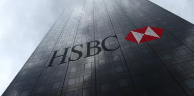 HSBC logo on a skyscraper facade reflecting clouds