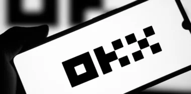 OKX logo on a mobile phone