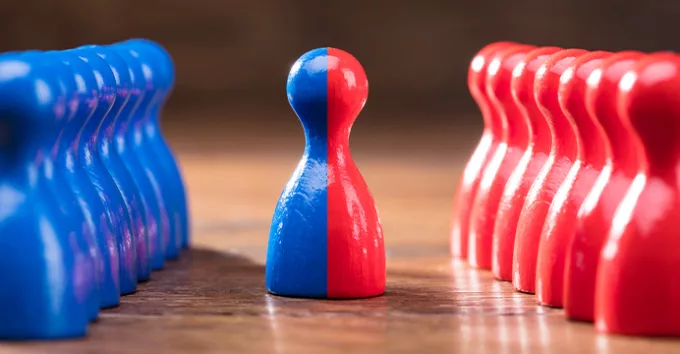 Two Rows Of Pawns Coming Together And Merging On Wooden Table