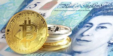 Bitcoin coins on Pound sterling banknote