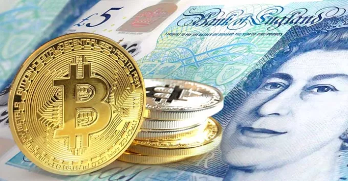 Bitcoin coins on Pound sterling banknote