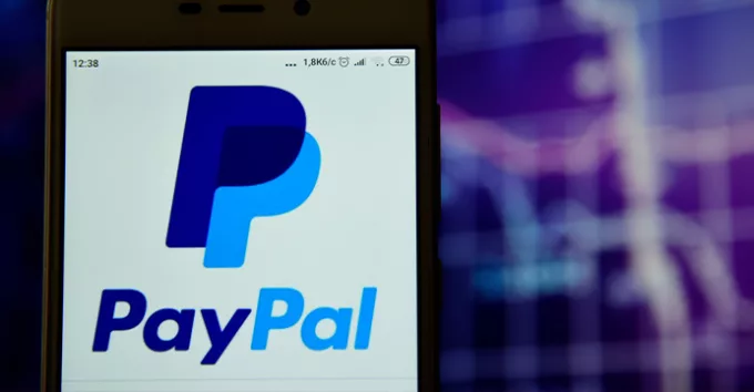 Paypal logo is seen on a smartphone