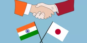 Hands shaken together with India and Japan flag
