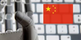 Robot hand with a China flag as a background