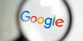 Google logo through magnifying glass