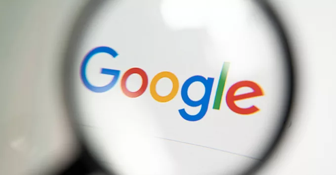 Google logo through magnifying glass