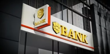 Bank signboard with fictitious logo on building