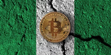 Digital coin with cracked Nigeria flag