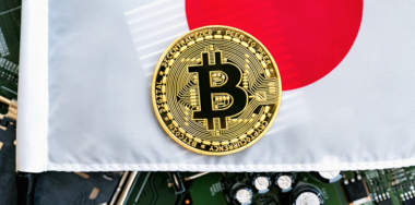 Gold coin with the national flag of Japan