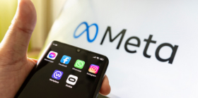 Meta logo with mobile phone