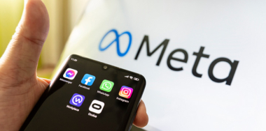 Meta logo with mobile phone