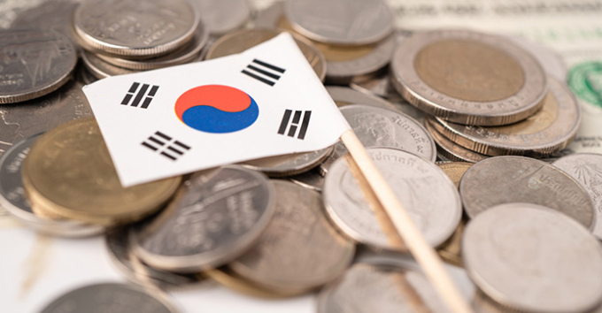 Stack of coins with South Korea flag