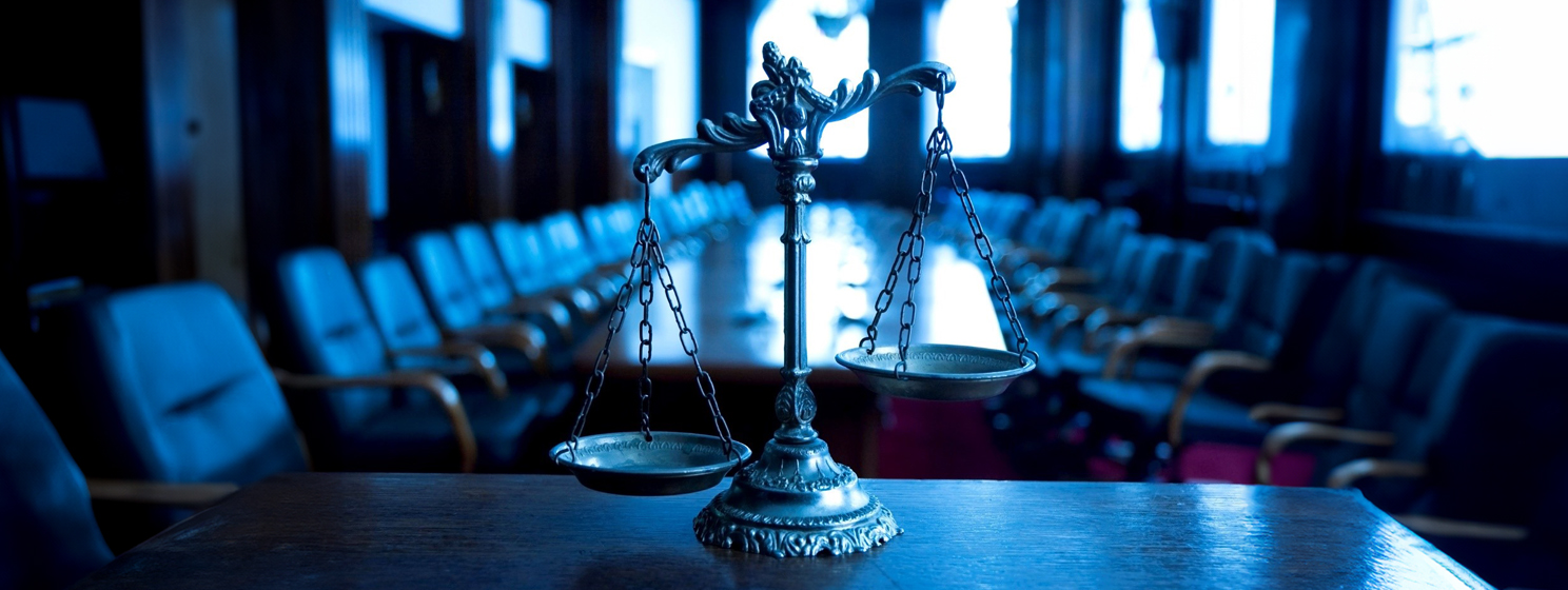 Scale of justice in the courtroom