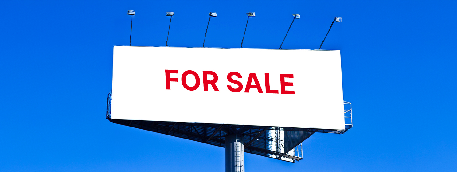 Big billboard with "For Sale" sign