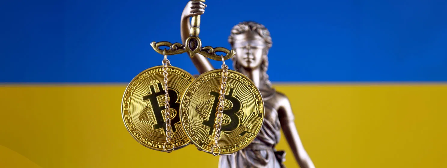 Lady justice and BTC coins on weighing scale over Ukraine flag