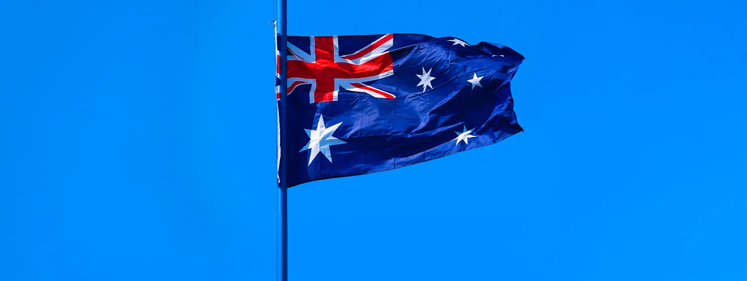 Flag of Australia on deep blue sky