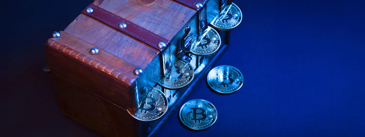 BTC coins in a treasure box