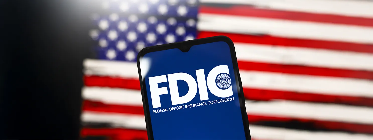 FDIC on phone screen with US flag on the background