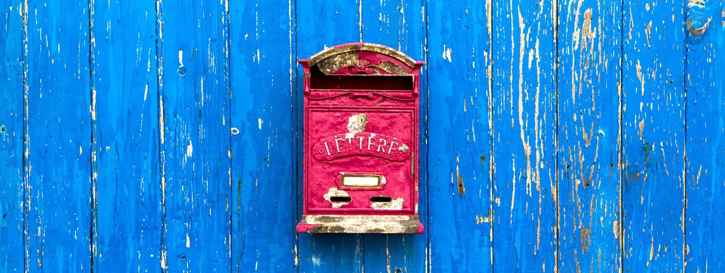 Blue wooden shabby door with postbox