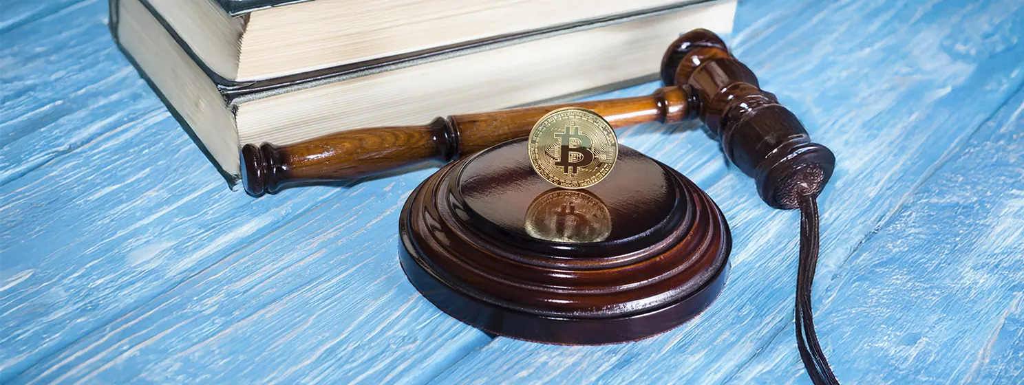 Judge's hammer and bitcoin gold coin