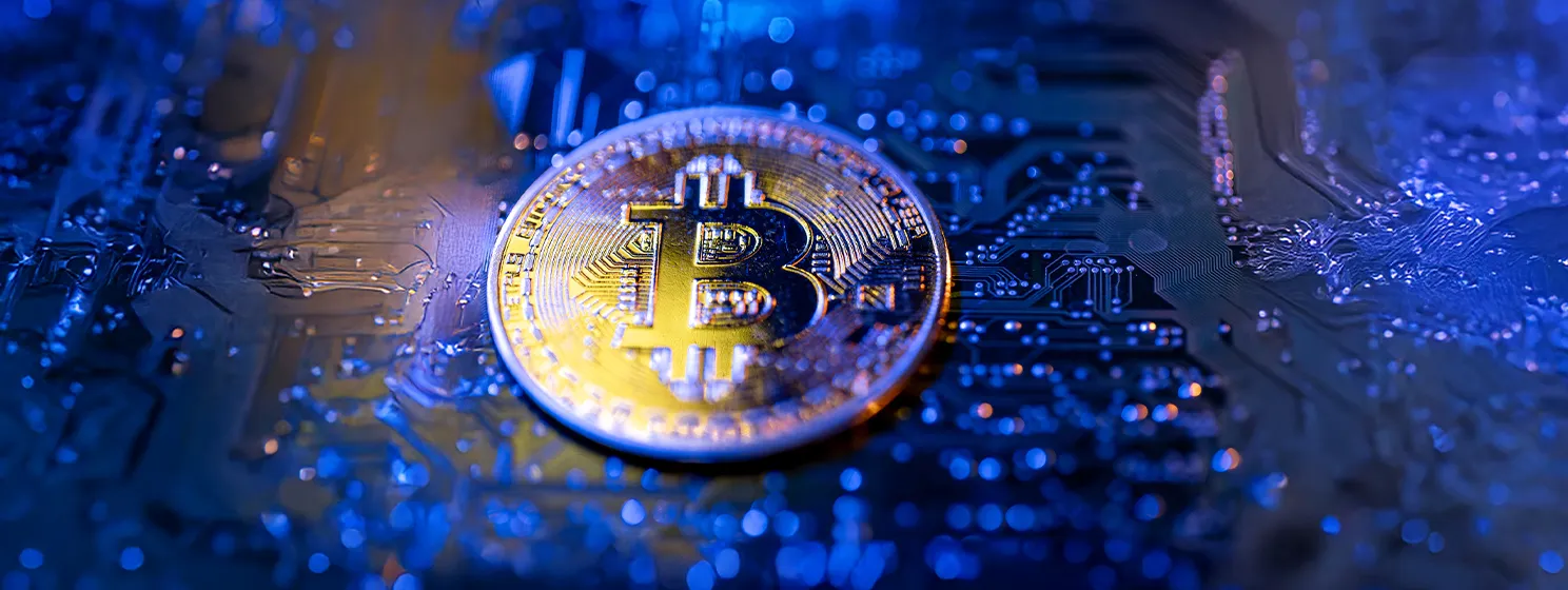 Bitcoin coin close-up on circuit board