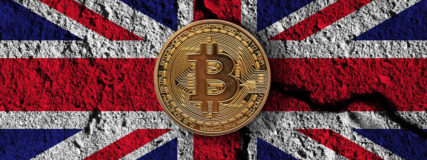 BTC coin over UK flag banner