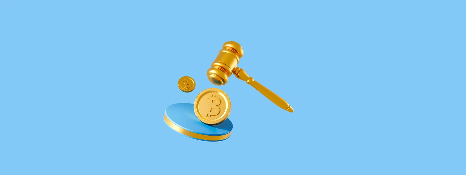 A golden gavel and Bitcoin coins