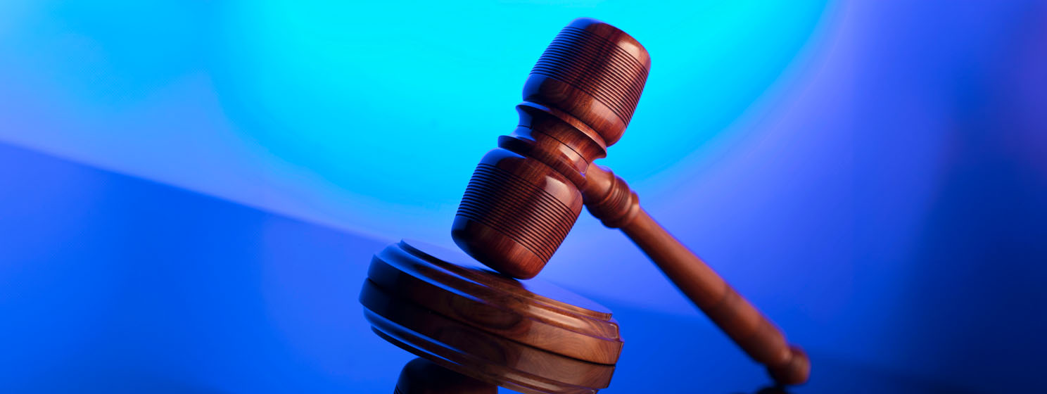 Judge hammer over blue gradient background