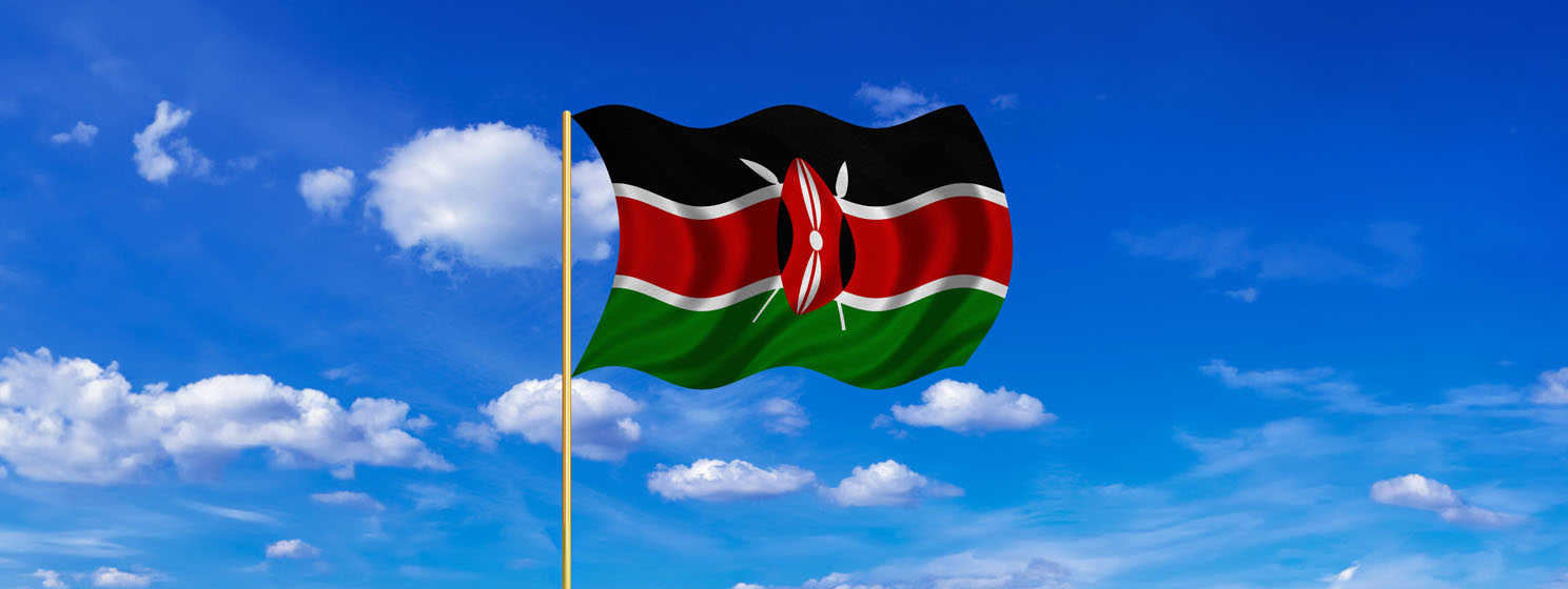 Flag of Kenya waving on blue sky background