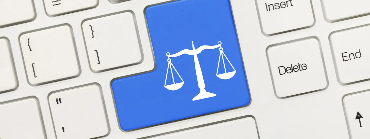 Law symbol on a blue key