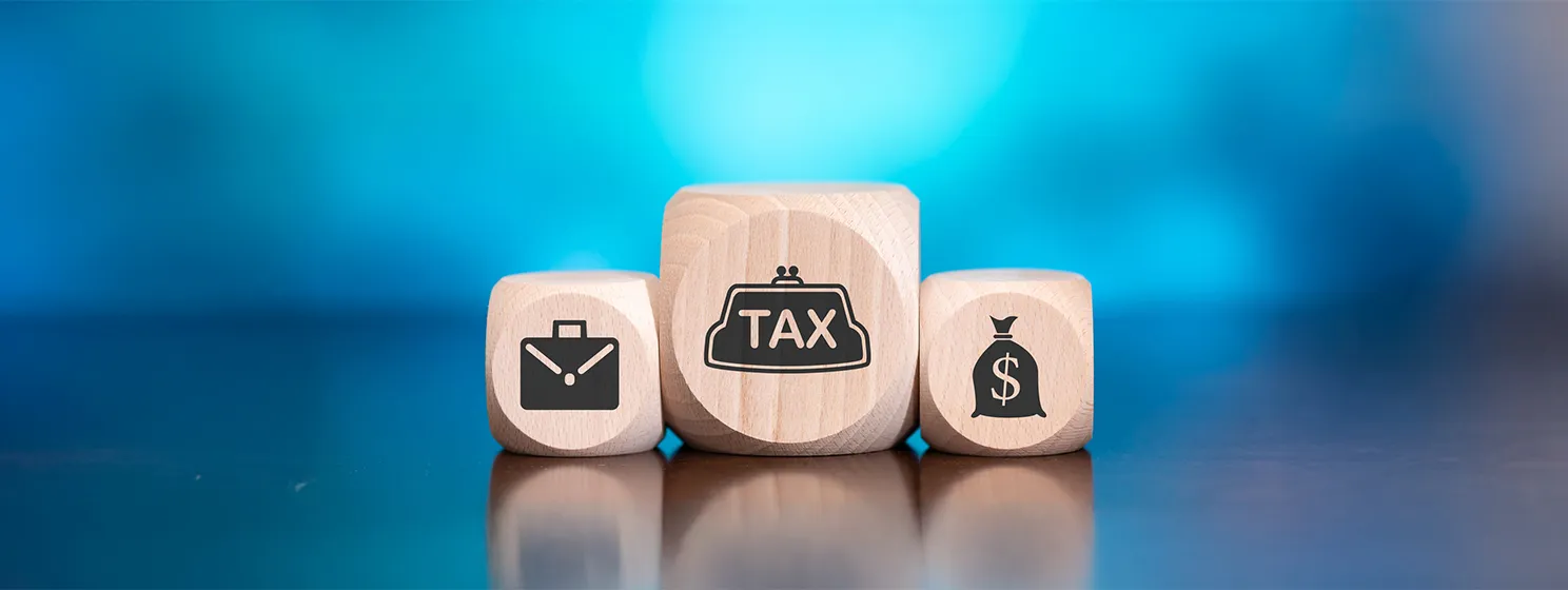 Wooden blocks with symbol of tax concept