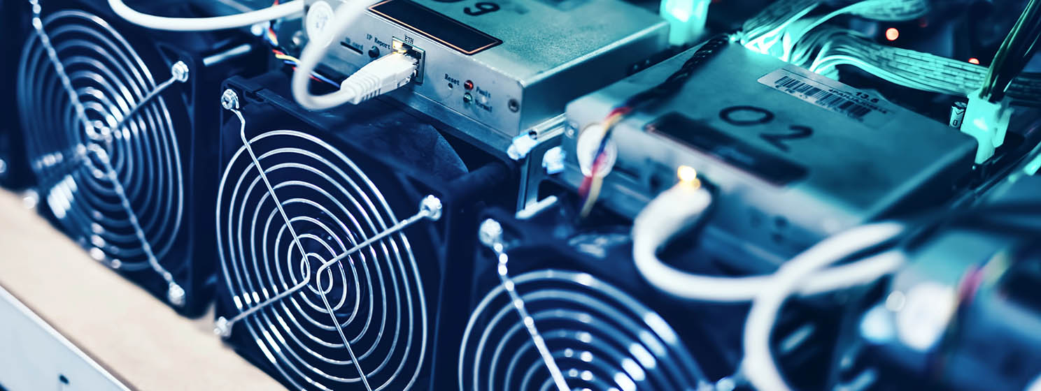 Bitcoin and crypto mining computer machines in a big data center. High tech servers at work.