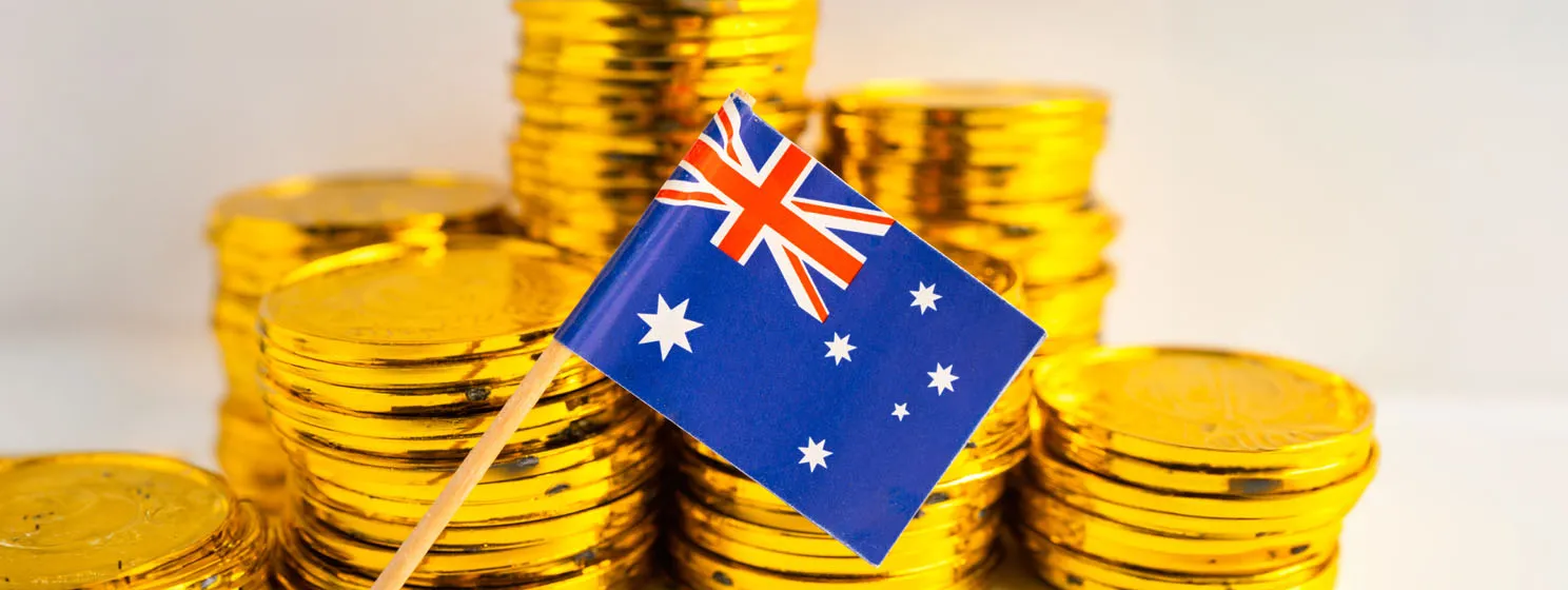 Australia flag and stack of gold coins concept background