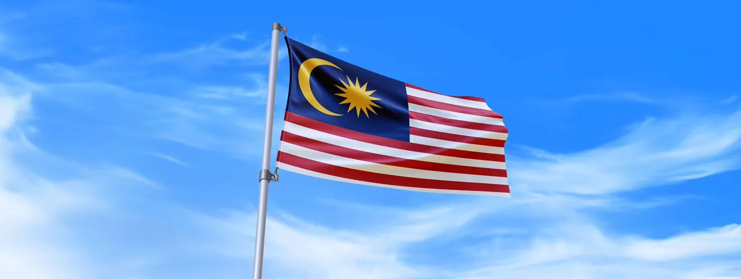 Malaysia flag waving in the wind with sky background