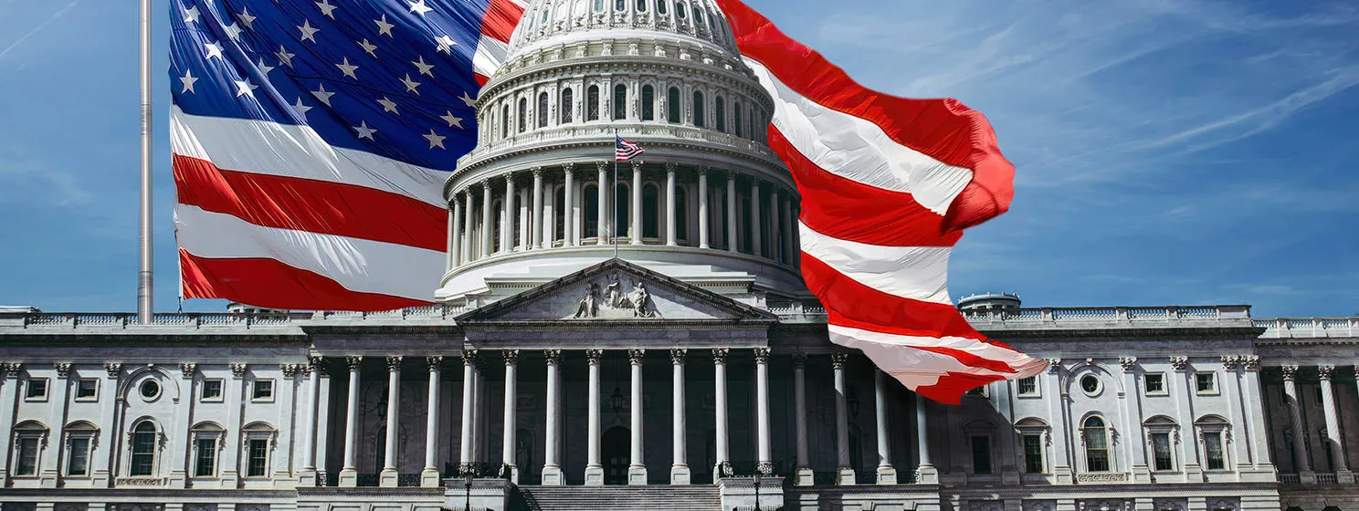 A flag and the U.S. Capitol Building in Washington D.C.
