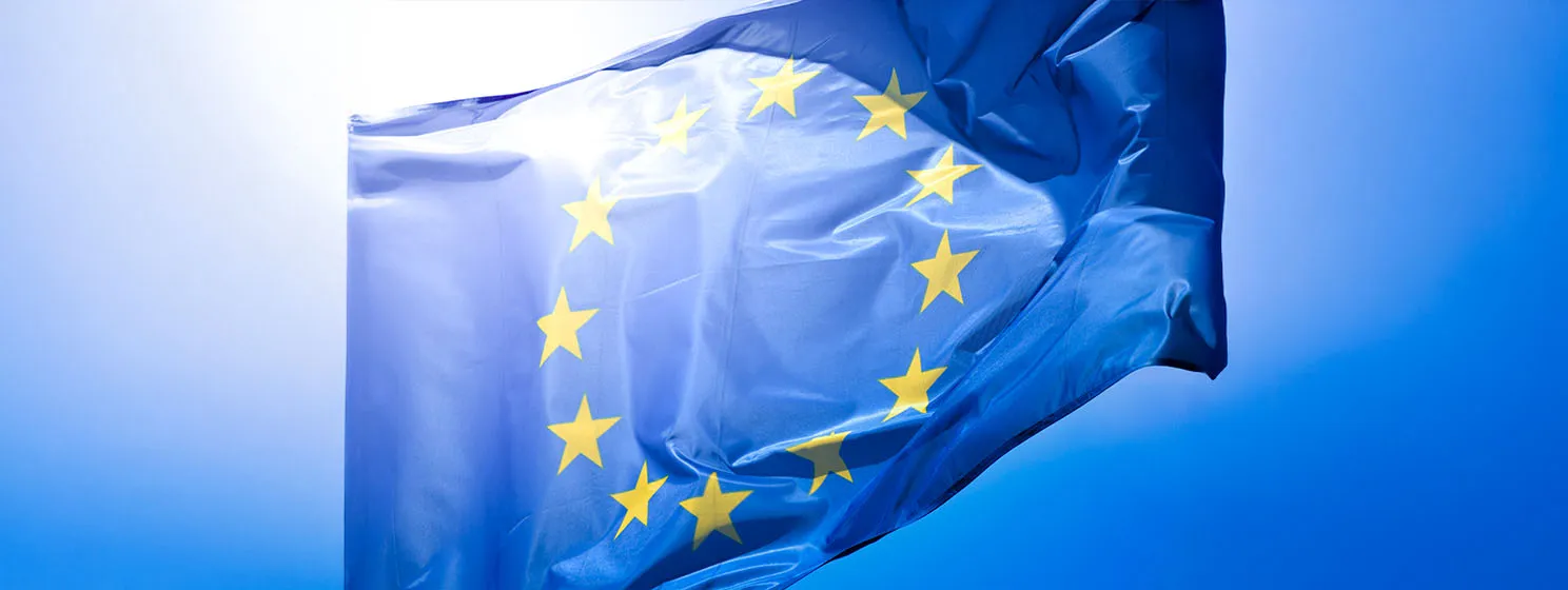 Material flag of European Union, sky in background.