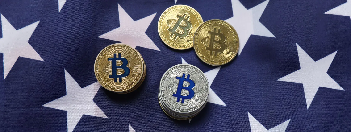 Bitcoin coins over US flag banner concept