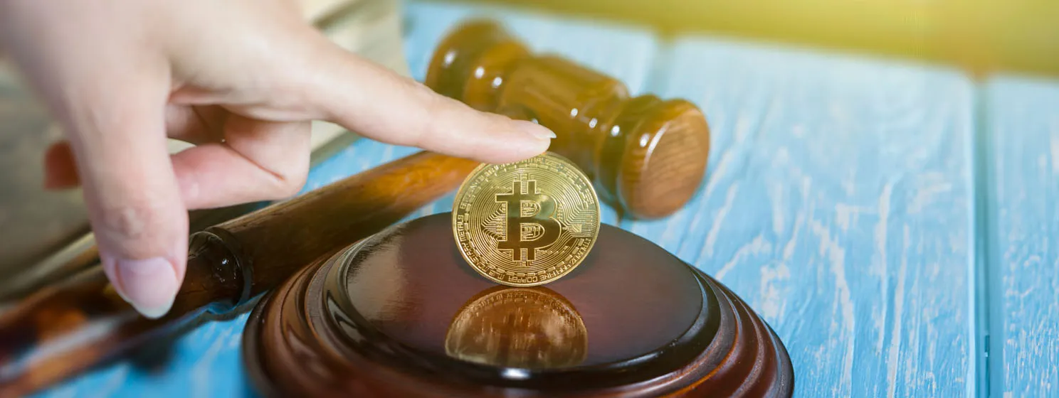 Judges hammer and bitcoin gold coin