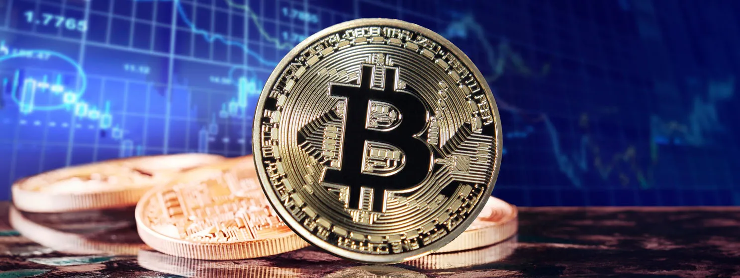 bitcoin coins over stock chart